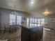 Kitchen boasts an island, granite countertops, and views into the living room at 650 N Hawes Rd # 2713, Mesa, AZ 85207