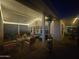 Covered back patio with stylish furniture, a ceiling fan, string lights and a heater for year-round comfort at 650 N Hawes Rd # 2713, Mesa, AZ 85207