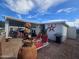 Backyard patio with seating, fountain, and grill at 650 N Hawes Rd # 2713, Mesa, AZ 85207