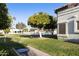 Landscaped backyard with a view of the community pool at 663 S Saguaro Way, Mesa, AZ 85208