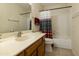 Bathroom features a vanity, toilet and bathtub at 663 S Saguaro Way, Mesa, AZ 85208