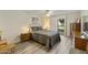 Bright bedroom with a double bed, wood-like flooring, and ample closet space at 663 S Saguaro Way, Mesa, AZ 85208