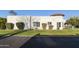 Well maintained home with grassy yard and mature shrubs at 663 S Saguaro Way, Mesa, AZ 85208