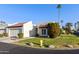 Exterior view of a charming condo with a two-car garage and desert landscaping at 663 S Saguaro Way, Mesa, AZ 85208