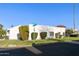 Spanish style home with landscaped yard and two-car garage at 663 S Saguaro Way, Mesa, AZ 85208