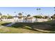 Community swimming pool area with surrounding lawn at 663 S Saguaro Way, Mesa, AZ 85208