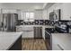 Modern kitchen featuring white cabinets, a farmhouse sink, and stainless steel appliances at 6644 E Snowdon Cir, Mesa, AZ 85215