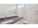 Bathroom features a granite countertop and a spacious walk-in shower with built-in shelves at 8470 W Mantle Way, Florence, AZ 85132