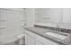 Bathroom features a granite countertop vanity, a mirror, and a shower/tub combo with built-in shelves at 8470 W Mantle Way, Florence, AZ 85132