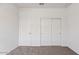 Bedroom with neutral carpet, closet, and neutral paint at 8470 W Mantle Way, Florence, AZ 85132