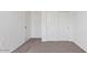Bedroom showcasing neutral carpet, closet, and neutral paint at 8470 W Mantle Way, Florence, AZ 85132