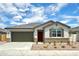 Charming single-story home with a well-manicured front yard, a garage, and a lovely front door at 8470 W Mantle Way, Florence, AZ 85132
