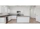 Modern kitchen with granite countertops, stainless steel appliances, and island at 8470 W Mantle Way, Florence, AZ 85132