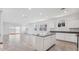 Bright kitchen with granite counters, stainless appliances and views to an open living area at 8470 W Mantle Way, Florence, AZ 85132