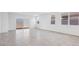 Bright living room with multiple windows and sliding door to outside at 8470 W Mantle Way, Florence, AZ 85132