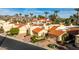 Wide aerial shot of single Gathering homes with red tile roofs and desert landscaping at 10050 E Mountainview Lake Dr # 39, Scottsdale, AZ 85258