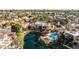 Stunning aerial view of a vibrant community, showcasing its lush landscaping, pools, and prime waterfront locations at 10050 E Mountainview Lake Dr # 39, Scottsdale, AZ 85258