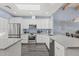 Modern kitchen with white cabinetry, stainless steel appliances, and a skylight providing ample light at 10050 E Mountainview Lake Dr # 39, Scottsdale, AZ 85258