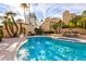 Community pool with clear blue water, palm trees, and well-maintained landscaping for resort-style living at 10050 E Mountainview Lake Dr # 39, Scottsdale, AZ 85258