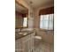 Bathroom with granite countertop and updated vanity at 10437 W Caron Dr, Sun City, AZ 85351