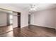 Bedroom with hardwood flooring, ample natural light and a sliding door closet at 10437 W Caron Dr, Sun City, AZ 85351