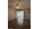 Living room with wood-look floors and French doors leading to sunroom at 10437 W Caron Dr, Sun City, AZ 85351