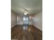 Bright living room with hardwood floors and a ceiling fan at 10437 W Caron Dr, Sun City, AZ 85351