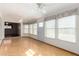 Bright sunroom with natural light and parquet floors, an extension of the living space at 10437 W Caron Dr, Sun City, AZ 85351