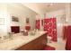 Bathroom with granite countertops and a walk-in shower at 10788 E Raintree Dr, Scottsdale, AZ 85255