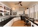 Bright home office with built-in shelving and dual workspaces at 10788 E Raintree Dr, Scottsdale, AZ 85255