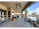 Spacious covered patio with seating and pool views at 10788 E Raintree Dr, Scottsdale, AZ 85255