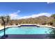 Inviting pool with mountain views and a tiled deck at 10788 E Raintree Dr, Scottsdale, AZ 85255