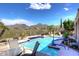 Inviting pool with mountain views; relaxing patio furniture at 10788 E Raintree Dr, Scottsdale, AZ 85255