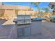 Backyard with built-in gas grill and desert landscape at 11222 E Oberlin Way, Scottsdale, AZ 85262