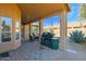 Covered patio with outdoor kitchen, barbecue, and dining set providing a perfect outdoor entertaining area at 11222 E Oberlin Way, Scottsdale, AZ 85262