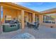 Covered patio complete with outdoor kitchen, barbecue, dining set for comfortable outdoor living at 11222 E Oberlin Way, Scottsdale, AZ 85262