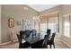 Formal dining area featuring modern chandelier and tile flooring at 11222 E Oberlin Way, Scottsdale, AZ 85262