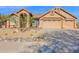 Charming single-story home with desert landscaping, a tile roof, and a three car garage at 11222 E Oberlin Way, Scottsdale, AZ 85262