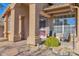 Inviting front porch with brick pavers, decorative columns and desert landscaping at 11222 E Oberlin Way, Scottsdale, AZ 85262