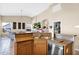 Open-concept kitchen with stainless steel appliances, granite counters, and seamless flow to the living areas at 11222 E Oberlin Way, Scottsdale, AZ 85262