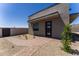 Modern home exterior featuring desert landscaping and a stone pathway to the front door at 12560 E Cochise Dr, Scottsdale, AZ 85259