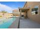 Inviting backyard oasis with a sparkling pool and patio area at 1278 E Geona Ct, San Tan Valley, AZ 85140