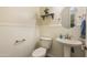 Clean bathroom with pedestal sink and wainscoting at 1278 E Geona Ct, San Tan Valley, AZ 85140