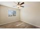 Spacious bedroom with ceiling fan and window at 1278 E Geona Ct, San Tan Valley, AZ 85140