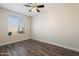 Bright bedroom with hardwood floors and large window at 1278 E Geona Ct, San Tan Valley, AZ 85140