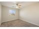 Well-lit bedroom with ceiling fan and window at 1278 E Geona Ct, San Tan Valley, AZ 85140