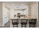 Kitchen island with seating for three and granite countertop at 1278 E Geona Ct, San Tan Valley, AZ 85140