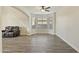 Living room with hardwood floors and large windows at 1278 E Geona Ct, San Tan Valley, AZ 85140