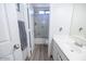 Bathroom with shower/tub combo, vanity, and wood-look flooring at 1425 S Lindsay Rd # 20, Mesa, AZ 85204