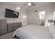 Bedroom with king-size bed, dresser, and en-suite bathroom access at 1425 S Lindsay Rd # 20, Mesa, AZ 85204